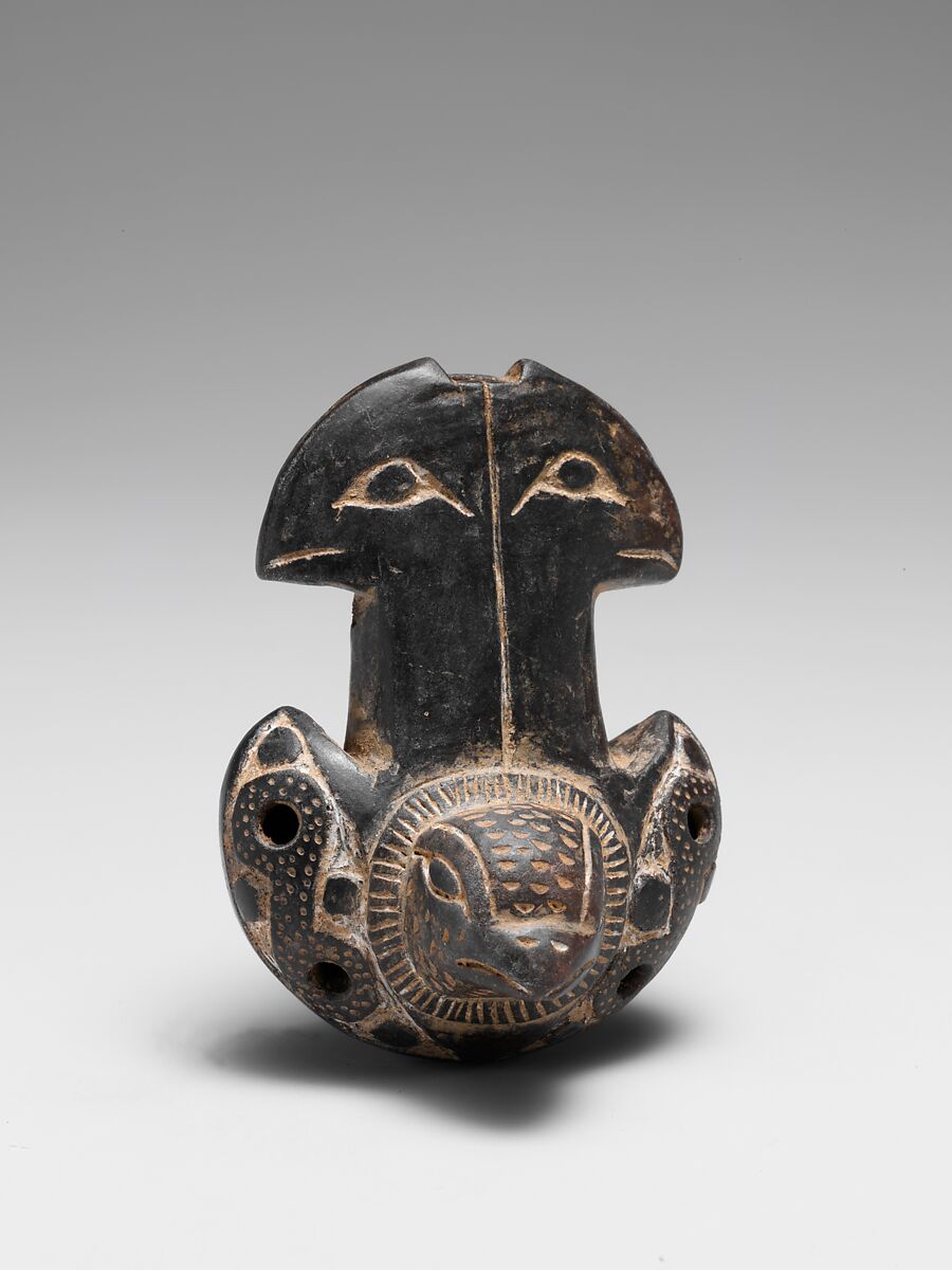 Uma ocarina de cerâmica em forma de pássaro
